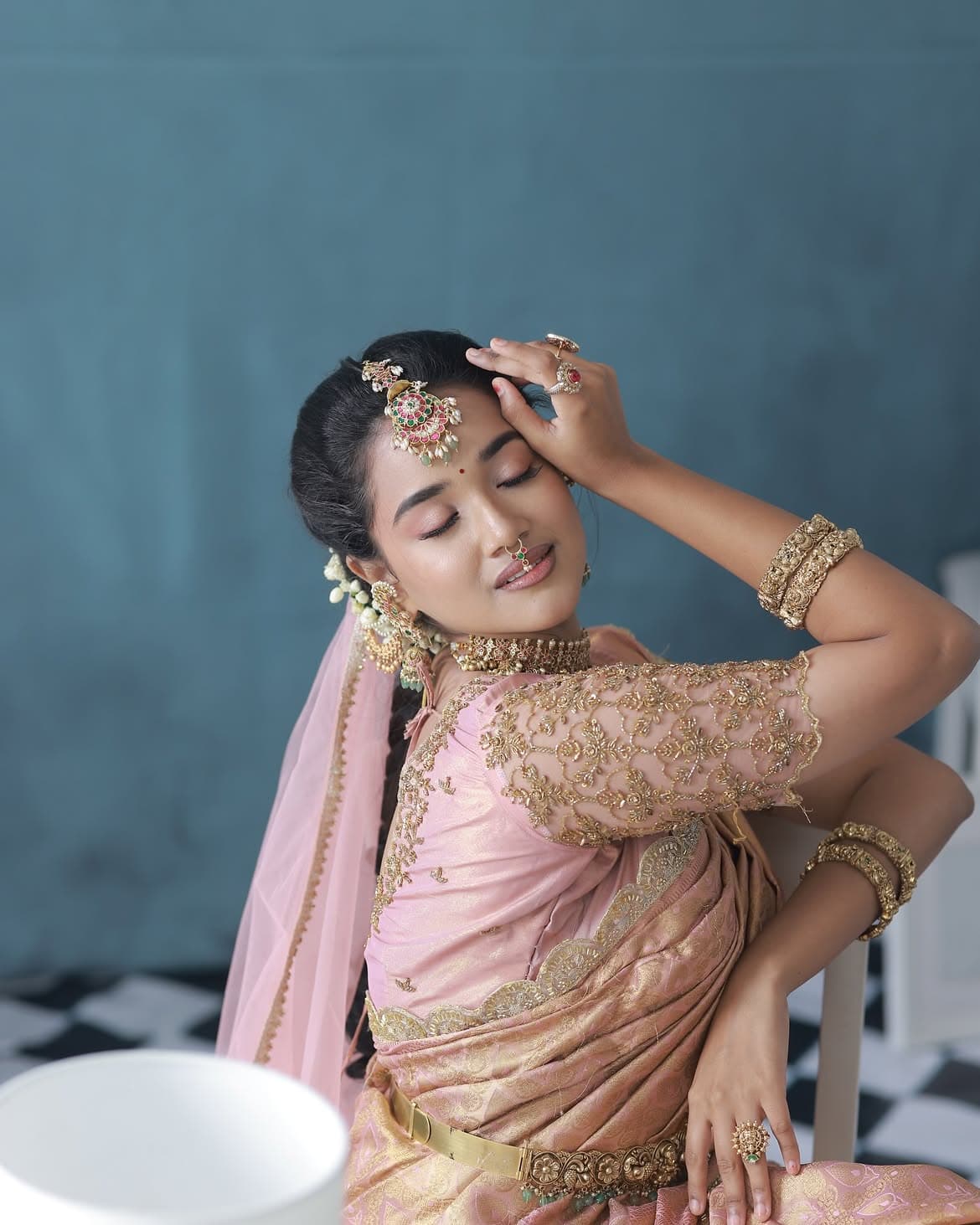 Nichayathartham Look — Nichayathartham look — soft peach blush, individual lash clusters.